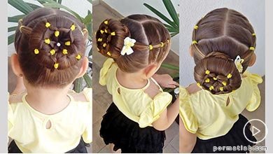 شینیون مجلسی موی کودک با طرح گل و تزیین کش های رنگی